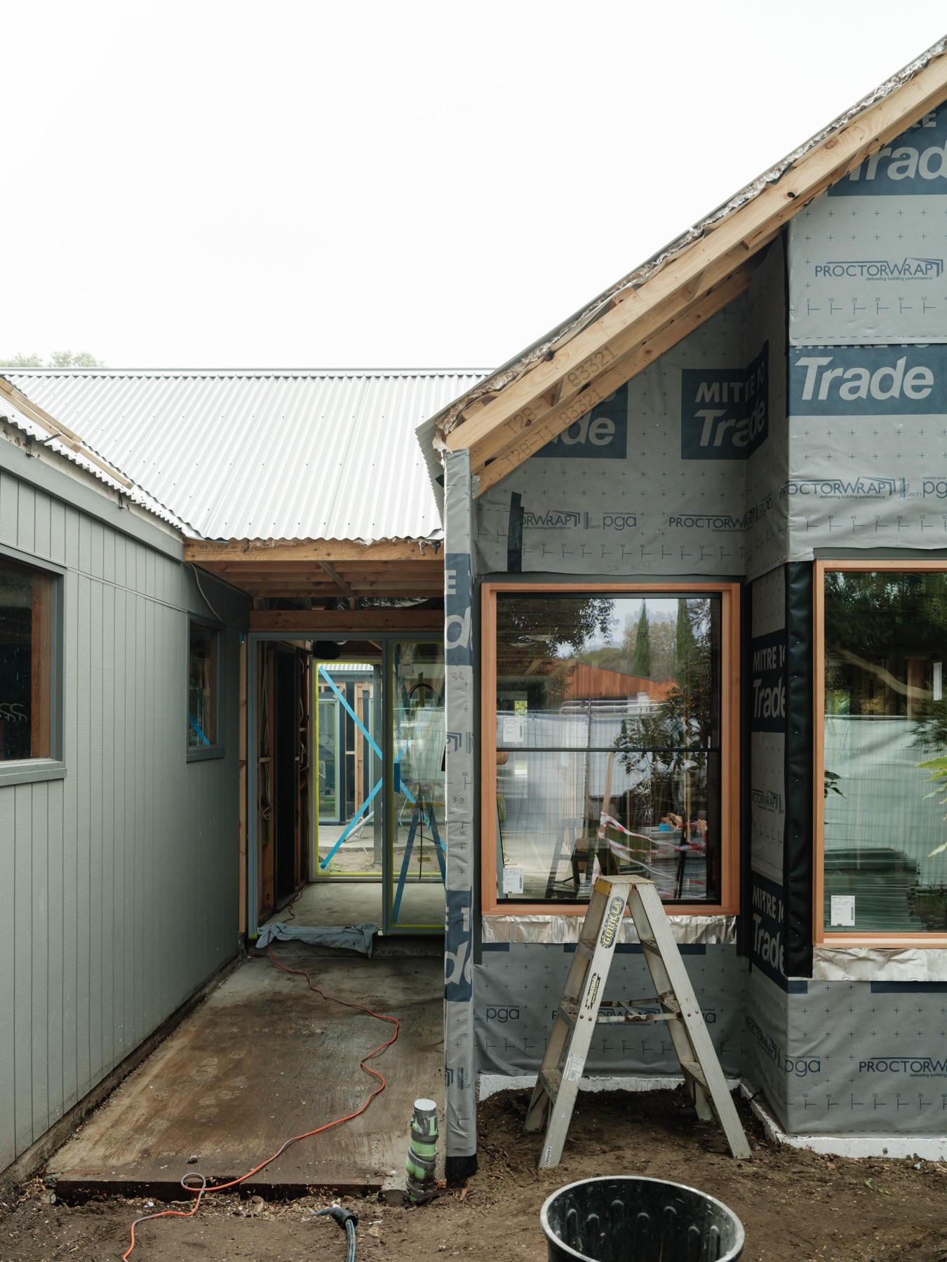 Sara St — facade, existing wing and new gable joined by a breezeway